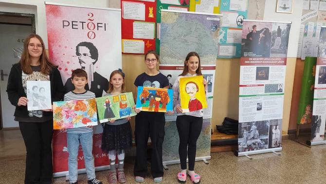 students with their paintings